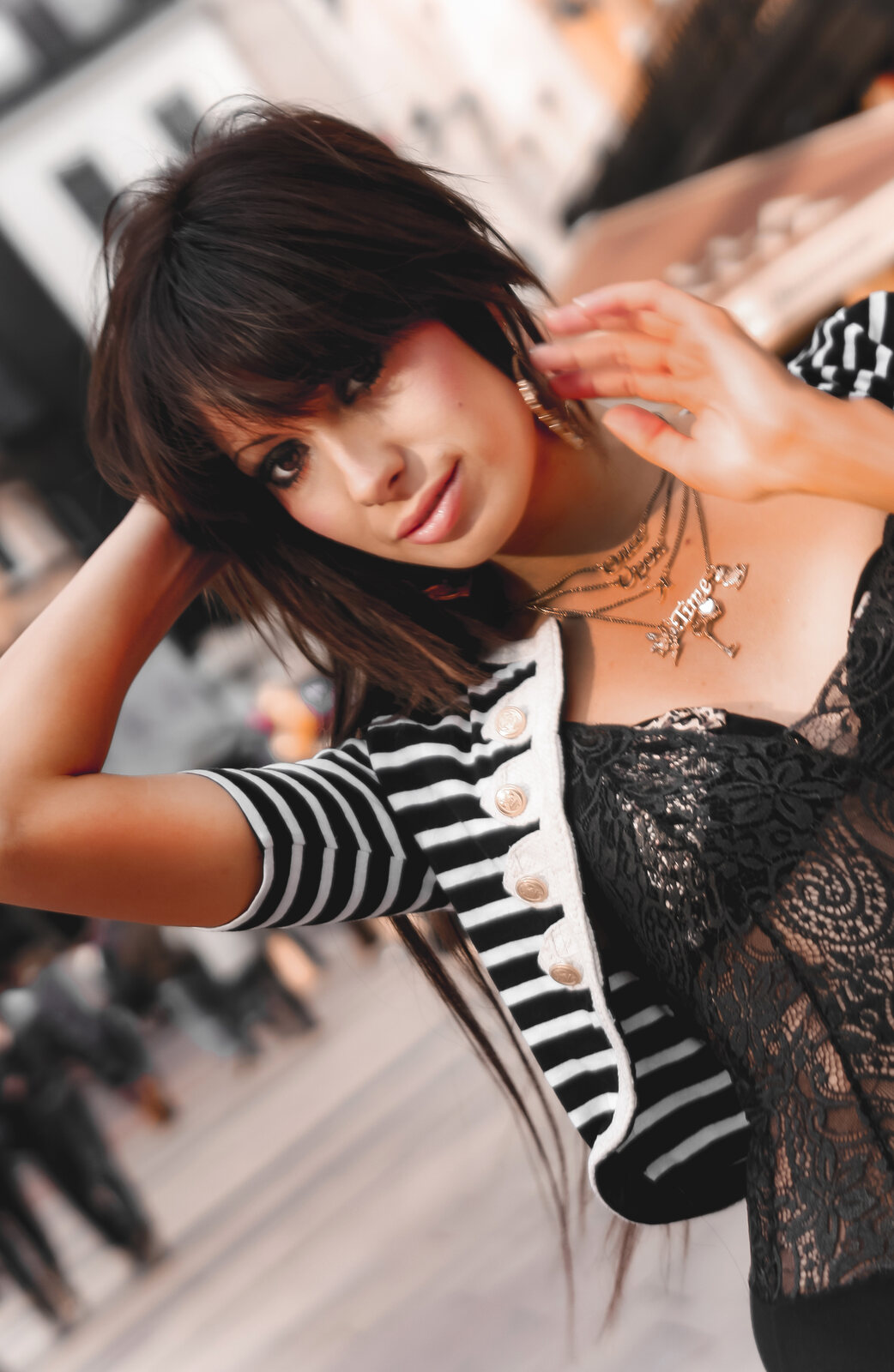 Dutch-angle close portrait of a model in a striped bolero